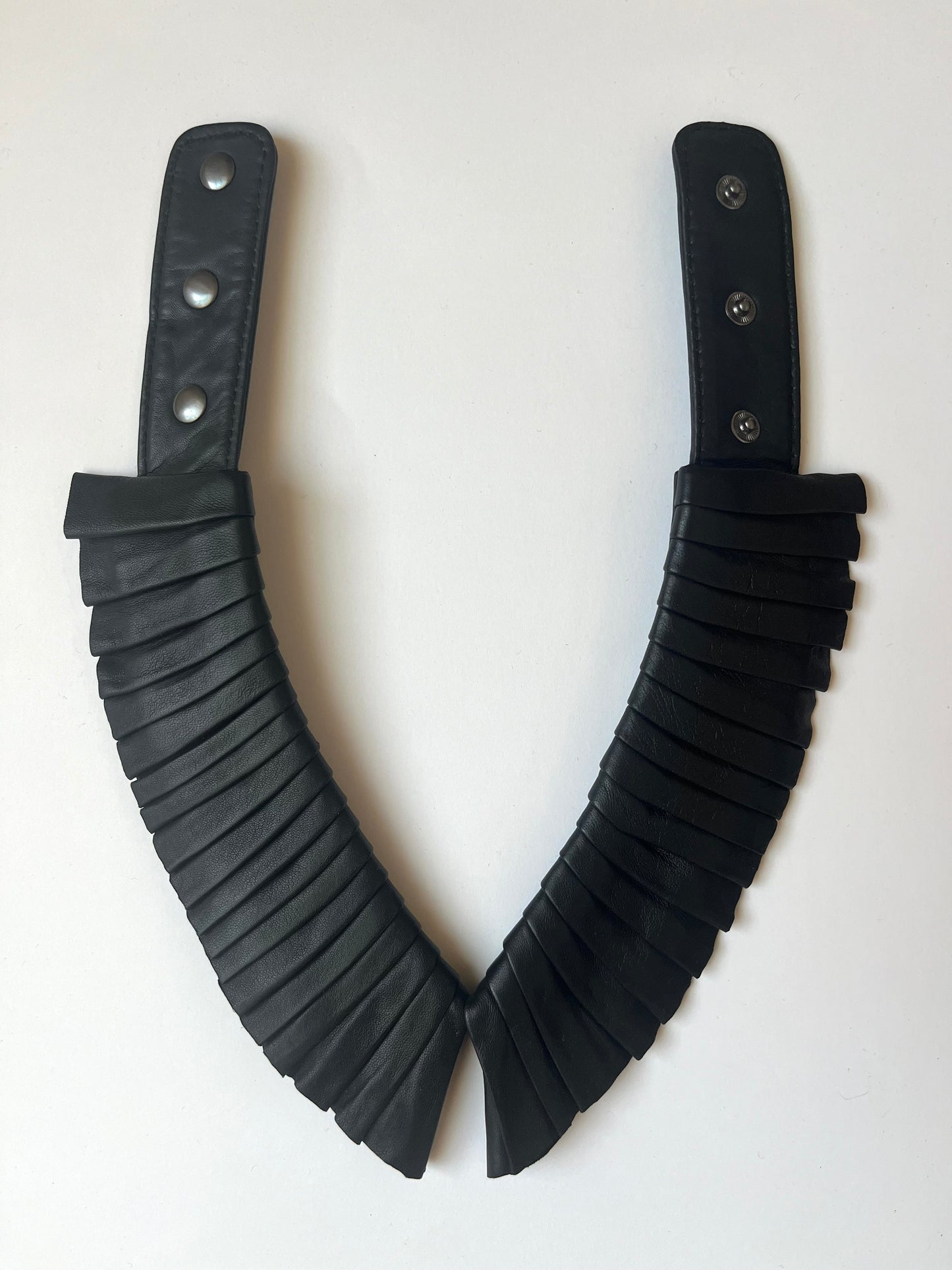 Denduon pleated leather collar black color unbuttoned and on white background