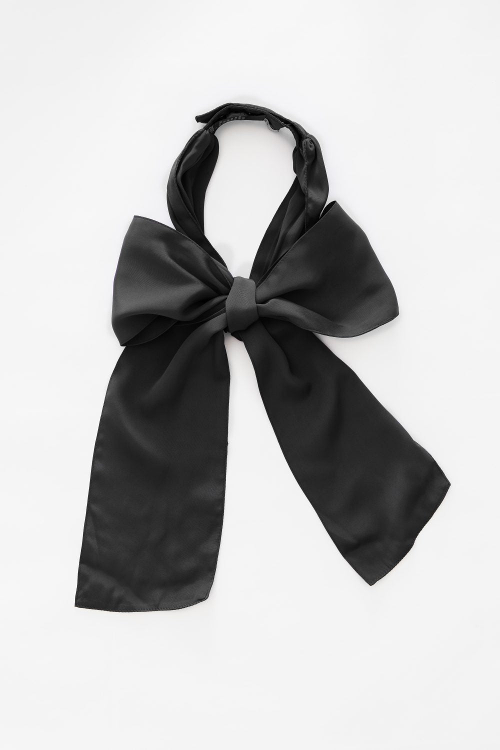 Denduon black textile bow on white backrgound