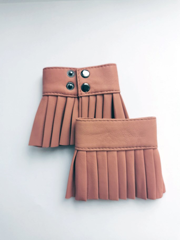Denduon pleated leather cuffs in blooming dahlia on a white background