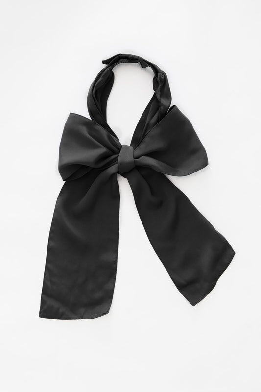 Denduon black textile bow on white backrgound